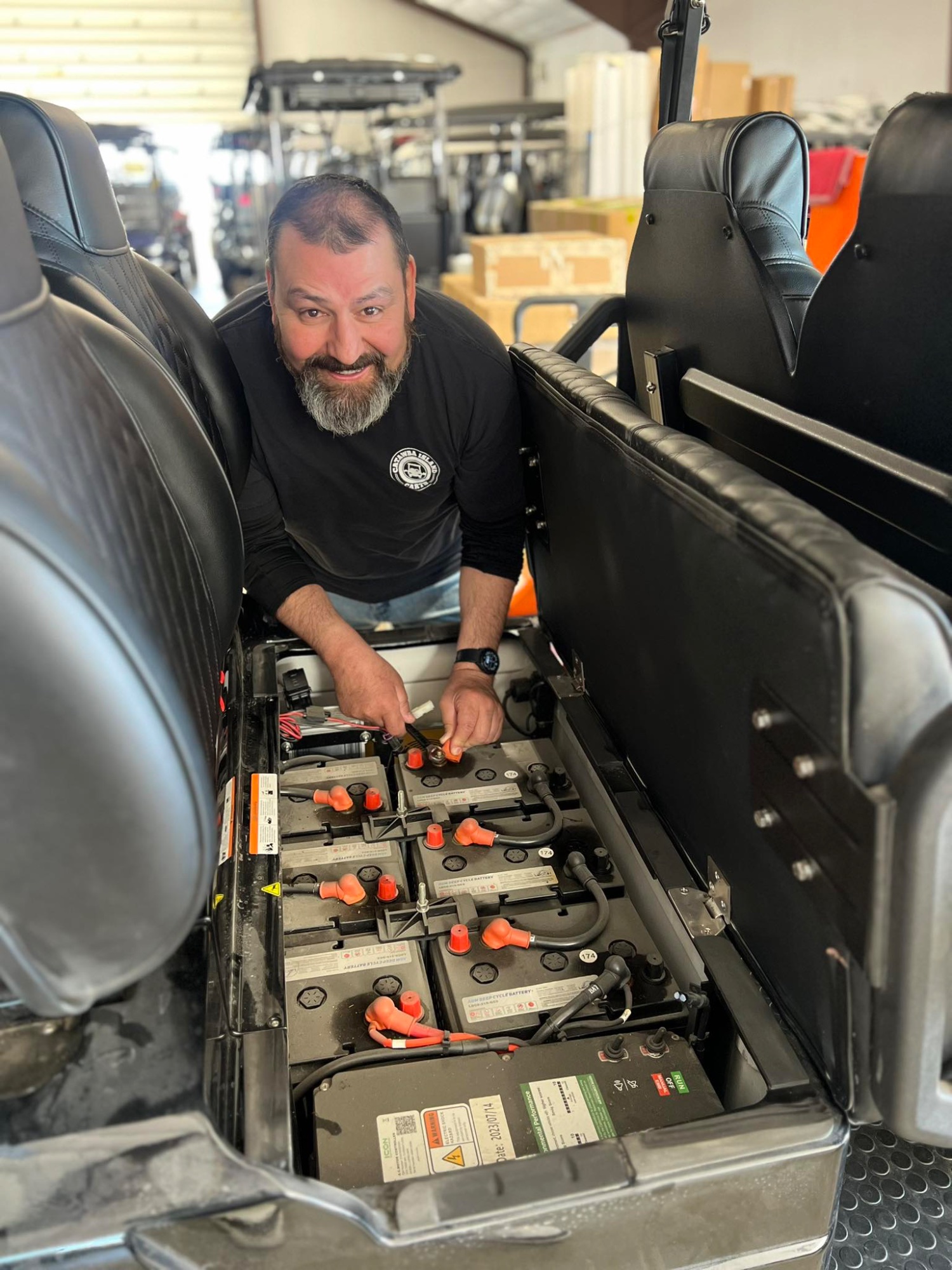 Service tech working on an electric moped battery